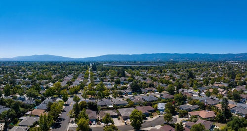 High angle view of townscape against clear blue sky