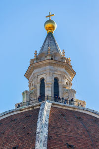 Low angle view of building against clear blue sky