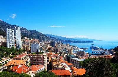 High angle view of townscape against blue sky