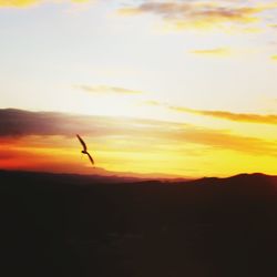 Scenic view of silhouette landscape against sky during sunset