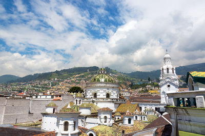 Buildings with mountain in background