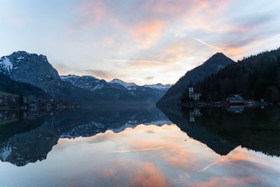 Scenic view of lake and mountains against sky during winter