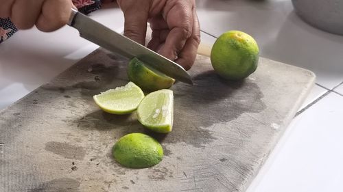 Close up cutting lime on cutting board in the kitchen