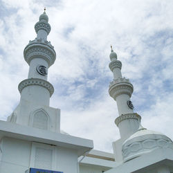 Low angle view of bell tower against sky