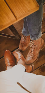 Low section of people over hardwood floor