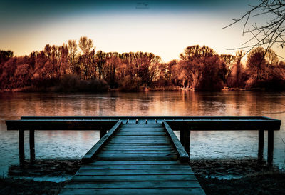 Pier over lake against sky