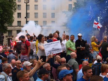 People standing on street in city