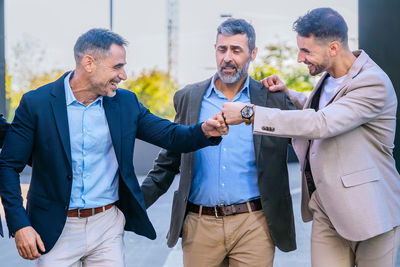 Business colleagues stacking hands