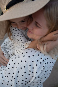 Close-up of mother and daughter embracing