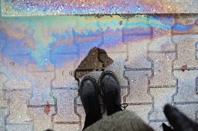 Low section of woman in puddle