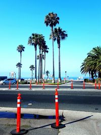 Road against clear blue sky