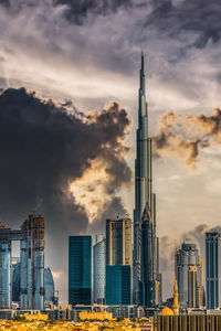 Low angle view of buildings against sky during sunset