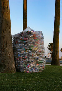 Close-up of garbage against trees