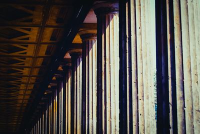 Low angle view of colonnade in corridor