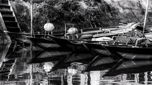 Rear view of man in boat against trees