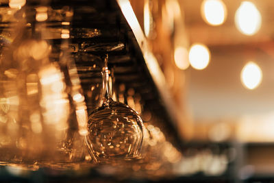 Close-up of illuminated electric lamp on table in restaurant