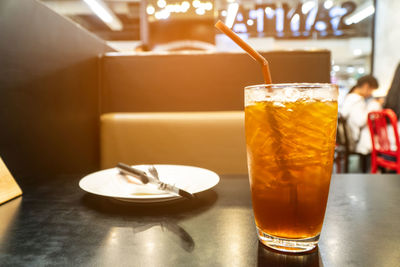 Close-up of drink in glass on table at restaurant