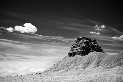 Rock formation on land against sky