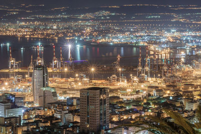 High angle view of illuminated cityscape at night