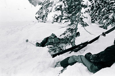 People skiing on snow covered mountain