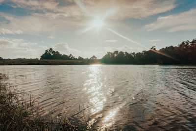 Scenic view of lake against sky during sunset