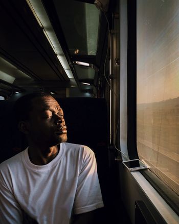 MAN LOOKING AT TRAIN