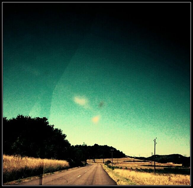 the way forward, road, transportation, diminishing perspective, landscape, vanishing point, country road, sky, field, tranquil scene, tranquility, blue, road marking, rural scene, tree, nature, empty road, countryside, empty, long