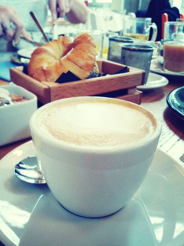 CLOSE-UP OF COFFEE CUP WITH COFFEE CUP