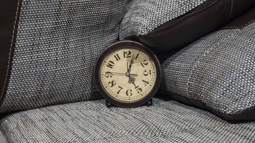 High angle view of clock on table