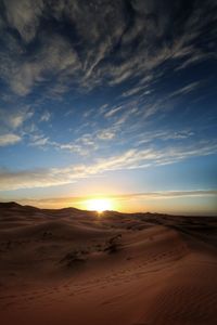 High angle view of sand dunes at sunset
