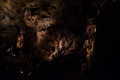Low angle view of illuminated cave
