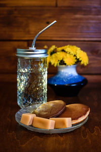 Close-up of a drink in a glass jar on the table, pancakes