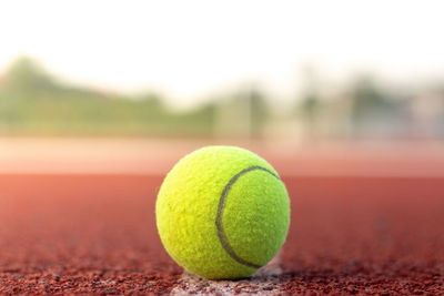 Close-up of tennis ball on court