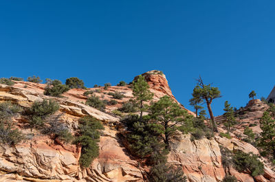 Scenic view of mountain against clear blue sky