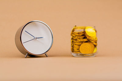 Close-up of coins in jar on table