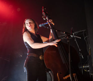 Young woman playing at music concert