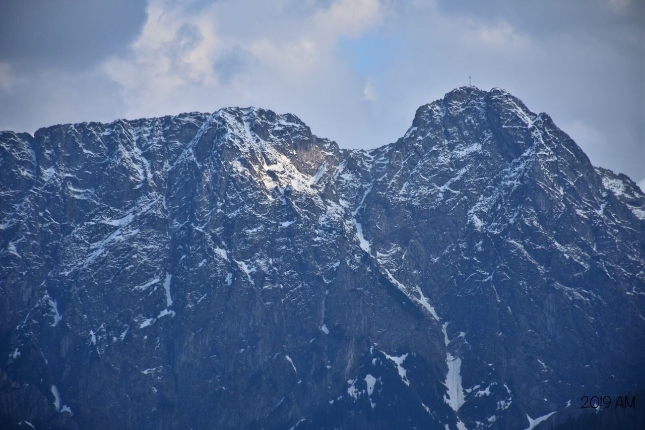 mountain, beauty in nature, snow, sky, cold temperature, winter, mountain range, scenics - nature, environment, mountain peak, nature, landscape, no people, snowcapped mountain, cloud - sky, non-urban scene, idyllic, tranquility, physical geography, formation