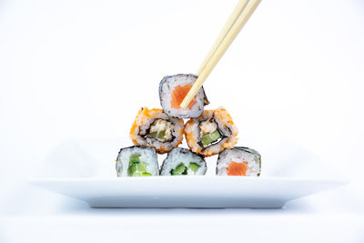 Close-up of sushi against white background