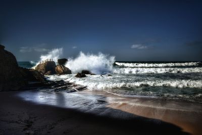 Scenic view of sea against sky on sunny day