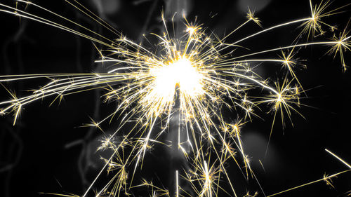 Close-up of firework display at night