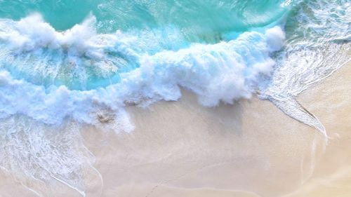 High angle view of waves at shore