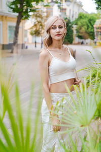 Happy young beautiful woman walking down street. portrait cheerful university