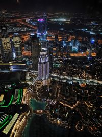High angle view of illuminated city buildings at night