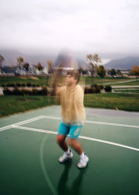Woman playing with ball in background