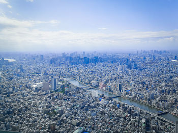 High angle view of city buildings against sky