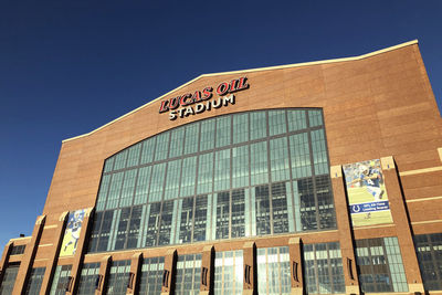 Low angle view of building against clear blue sky