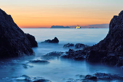 Scenic view of sea against sky during sunset