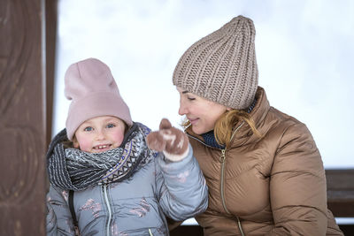 Portrait of smiling mother and daughter