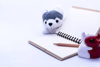 High angle view of stuffed toy against white background