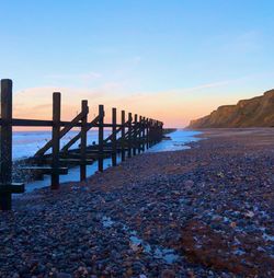 Scenic view of sea against clear sky during sunset